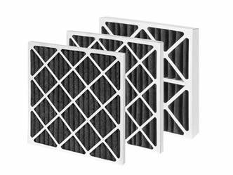 Three pieces of pleated carbon filter with paperboard support layer.